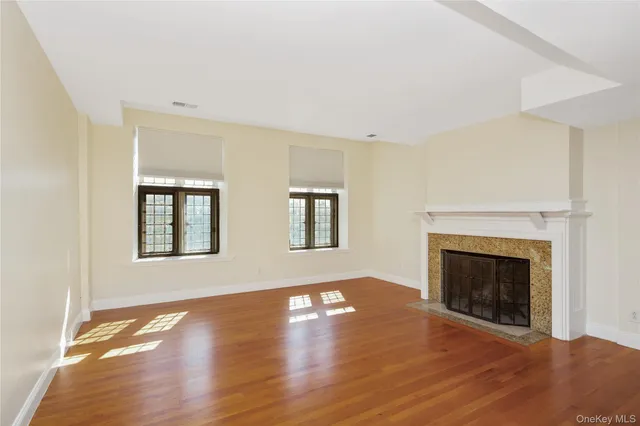 a view of kitchen and hall with wooden floor