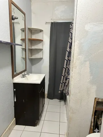 a bathroom with a sink and mirror