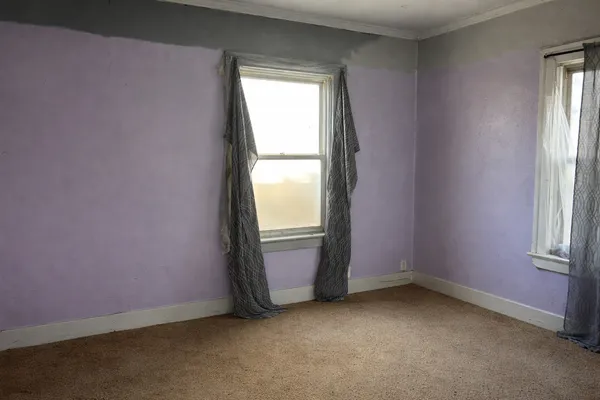 an empty room with windows