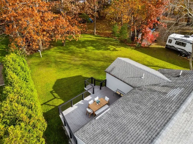 a view of a swimming pool with a yard