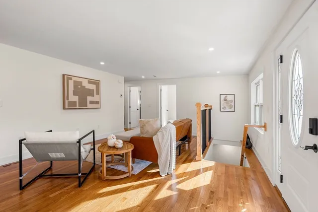 a view of a livingroom with furniture and a wooden floor