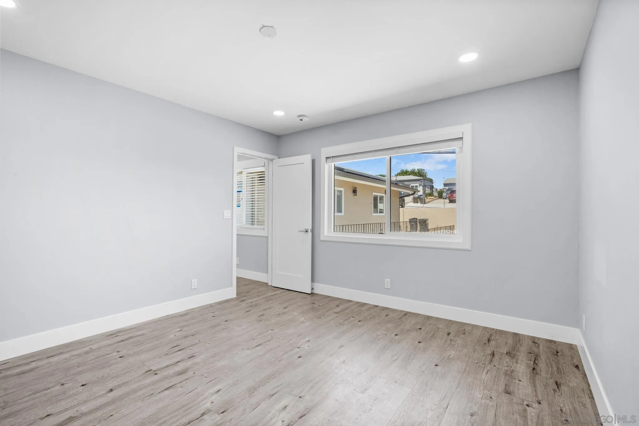 1908 Washington Street Lemon Grove, CA 91945 - Photo 12 of 54 an empty room with wooden floor and window