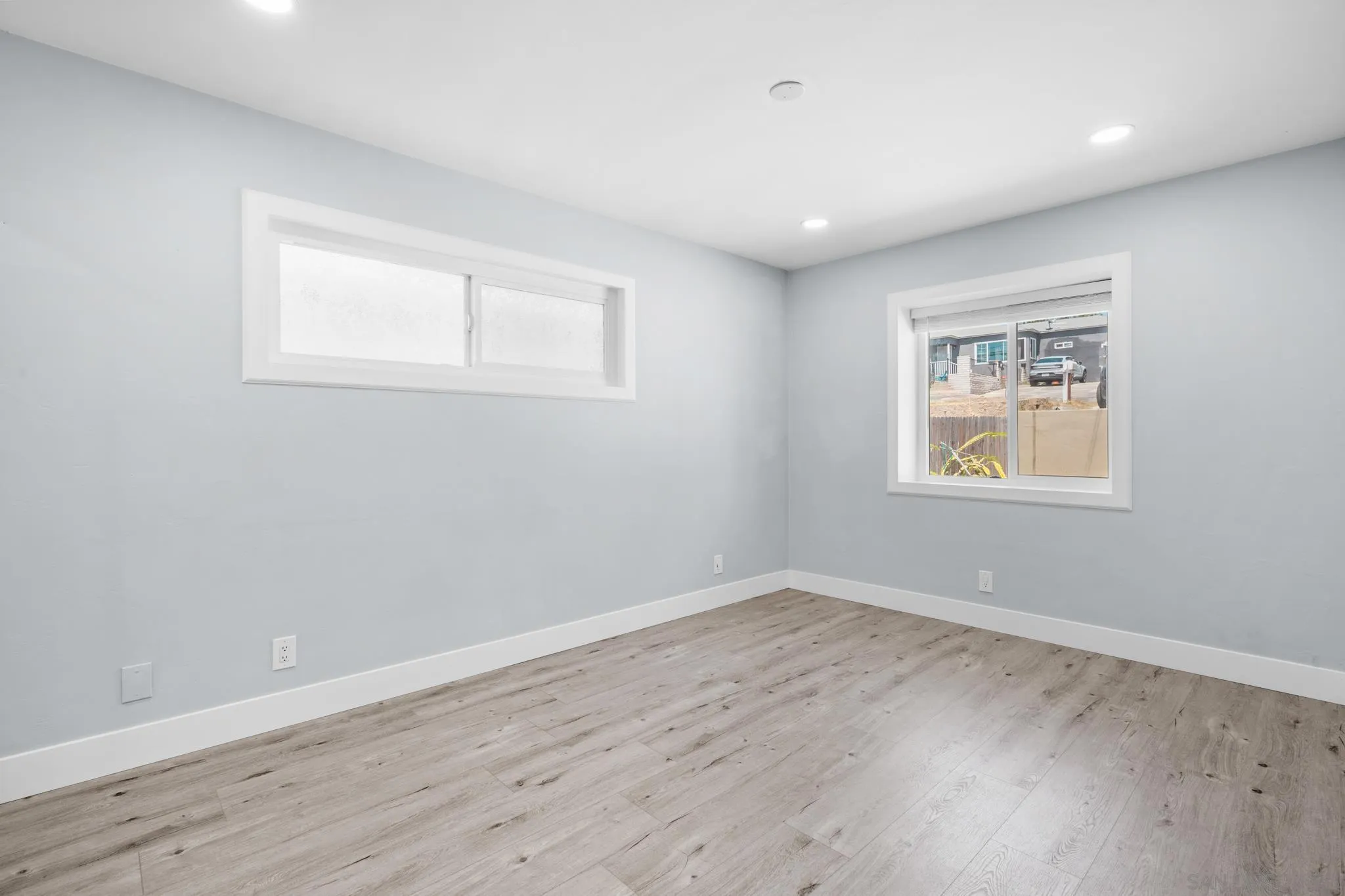 1908 Washington Street Lemon Grove, CA 91945 - Photo 19 of 54 a view of an empty room with wooden floor and a window