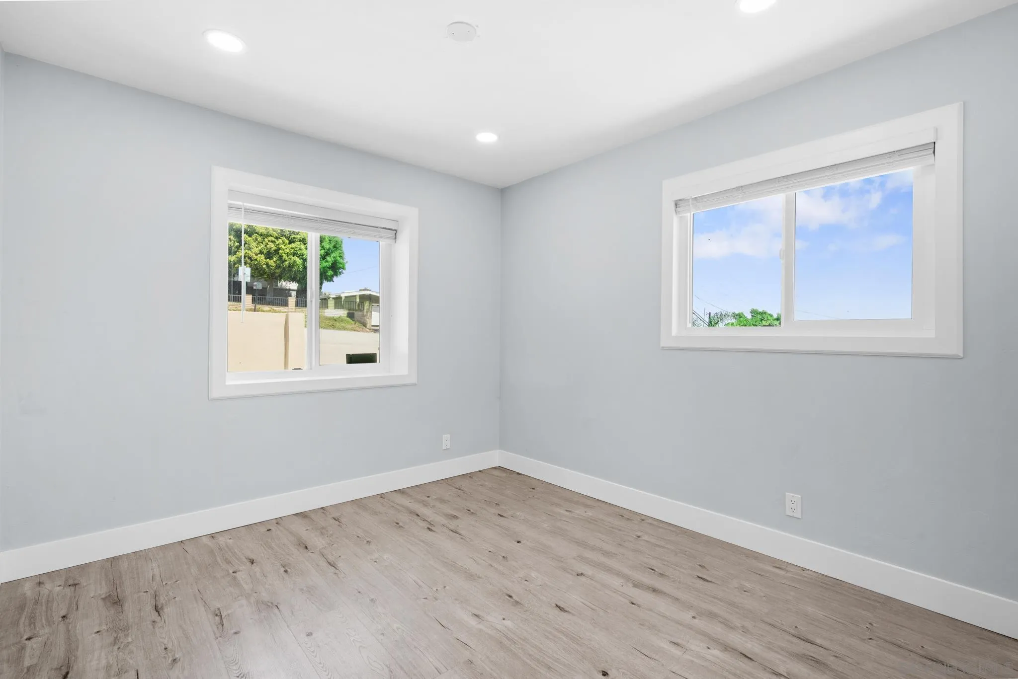 1908 Washington Street Lemon Grove, CA 91945 - Photo 20 of 54 an empty room with wooden floor and windows
