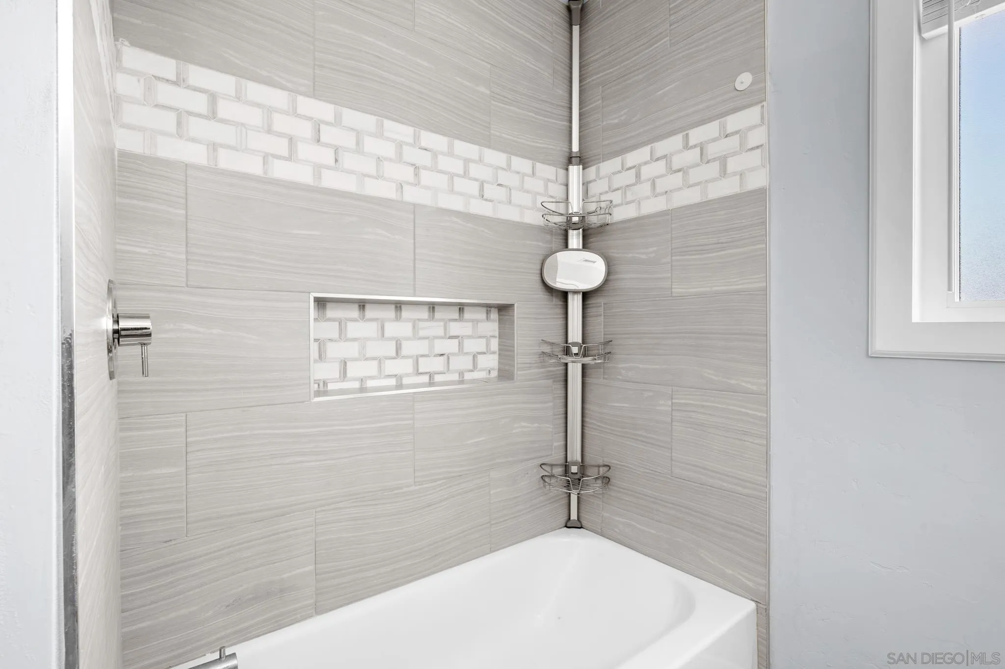 1908 Washington Street Lemon Grove, CA 91945 - Photo 23 of 54 a bathroom with a shower and a chandelier