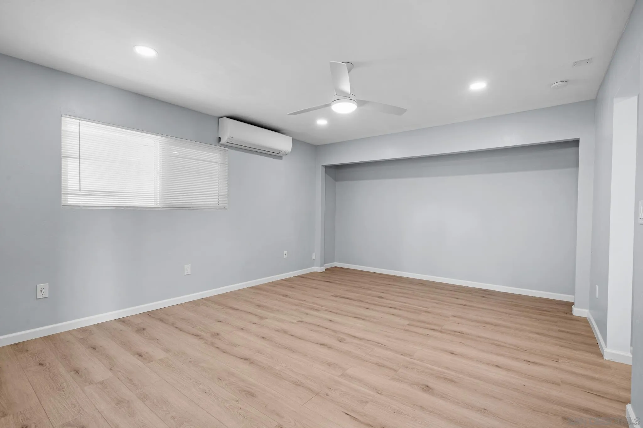 1908 Washington Street Lemon Grove, CA 91945 - Photo 28 of 54 an empty room with wooden floor and windows