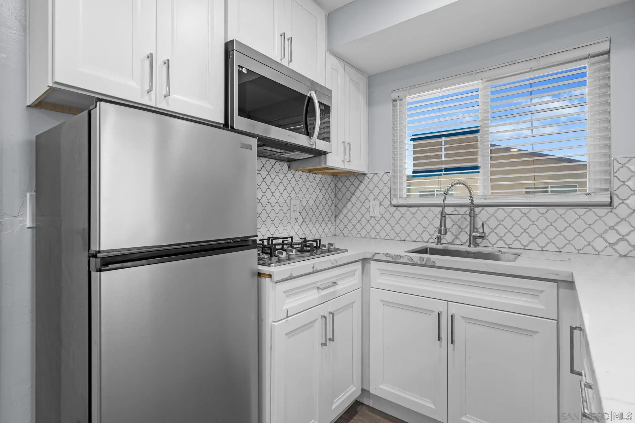 1908 Washington Street Lemon Grove, CA 91945 - Photo 38 of 54 a kitchen with a refrigerator stove and microwave