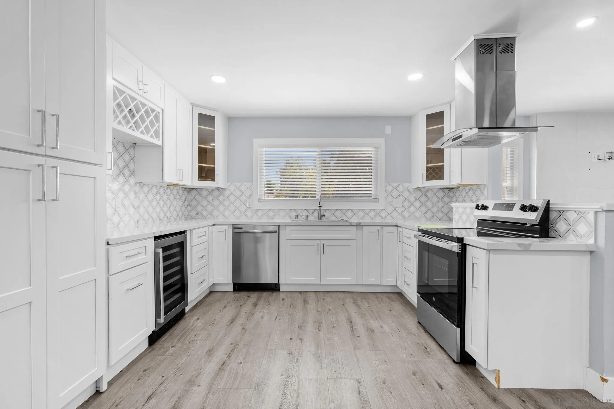 1908 Washington Street Lemon Grove, CA 91945 - Photo 6 of 54 a kitchen with granite countertop a sink cabinets stainless steel appliances and a window
