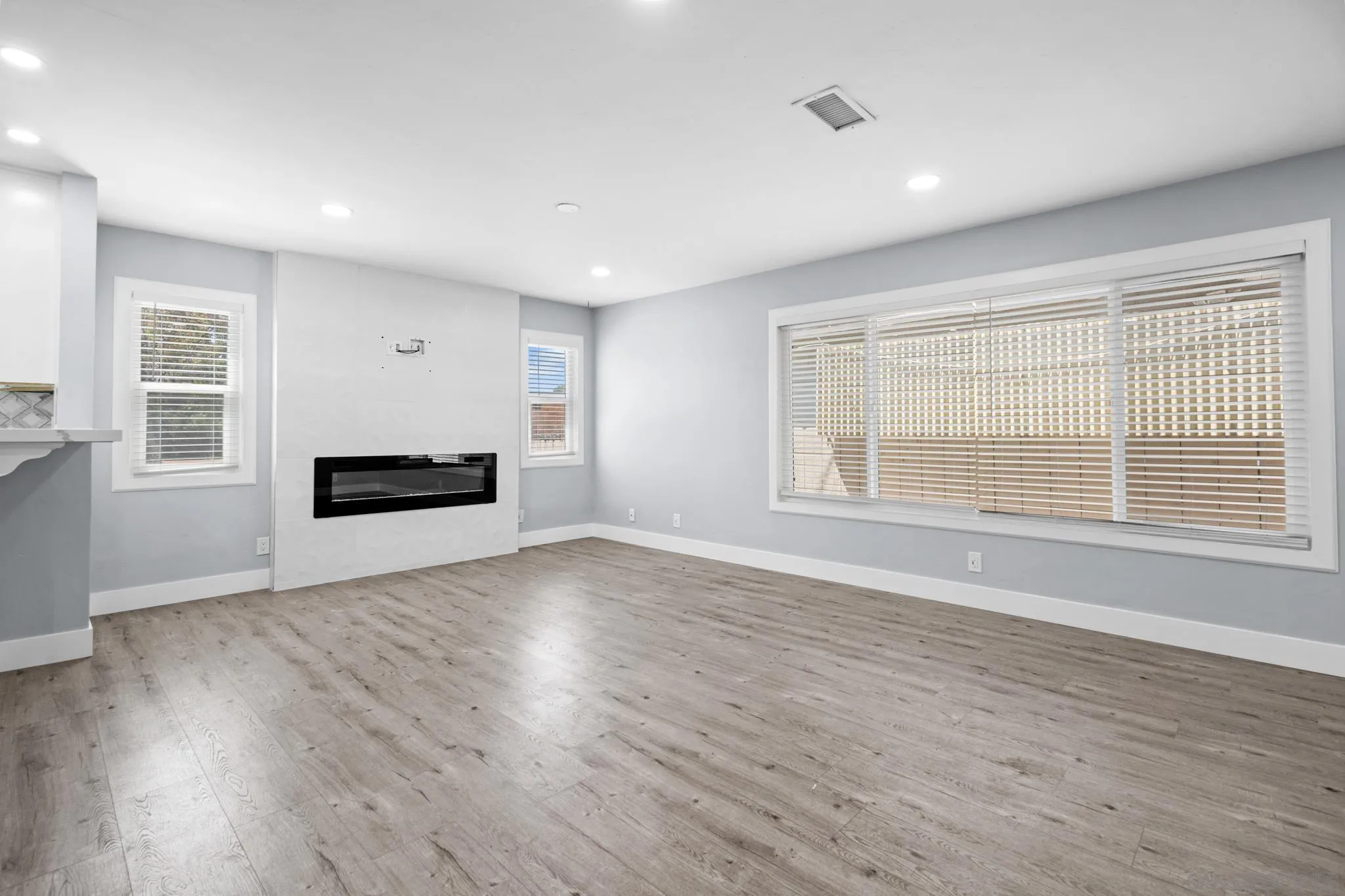 1908 Washington Street Lemon Grove, CA 91945 - Photo 7 of 54 a view of empty room with wooden floor and fan