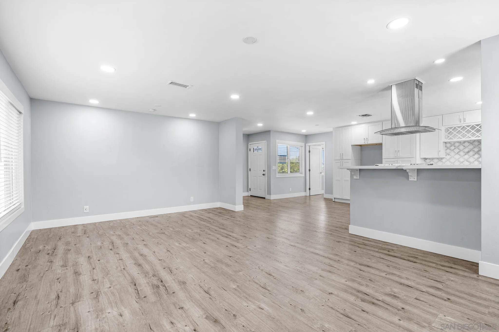 1908 Washington Street Lemon Grove, CA 91945 - Photo 9 of 54 an empty room with wooden floor and windows