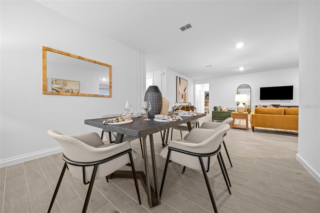 8735 Southwest 67th Circle Ocala, FL 34476 - Photo 12 of 35 a view of a dining room with furniture and a window
