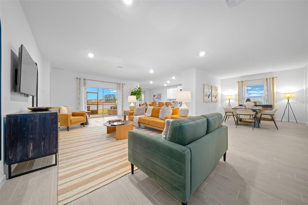 8735 Southwest 67th Circle Ocala, FL 34476 - Photo 22 of 35 a living room with furniture and a flat screen tv