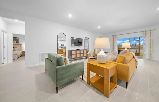 a bed room with furniture and a table