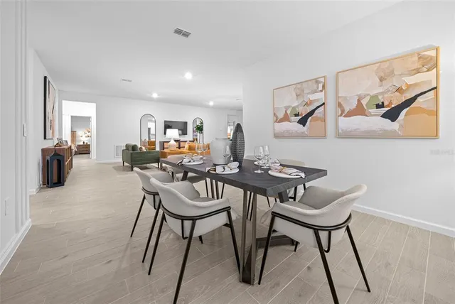 a bathroom with a sink mirror and a shower