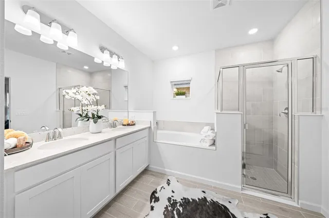 a bathroom with a sink a mirror and a bathtub