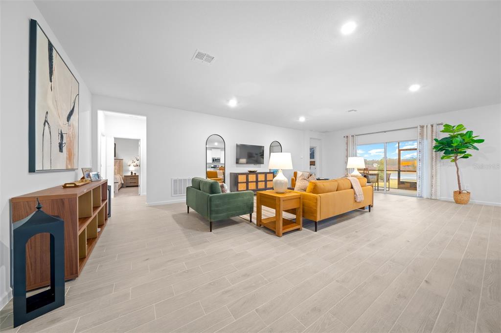 8735 Southwest 67th Circle Ocala, FL 34476 - Photo 32 of 35 a spacious bedroom with furniture and a large window