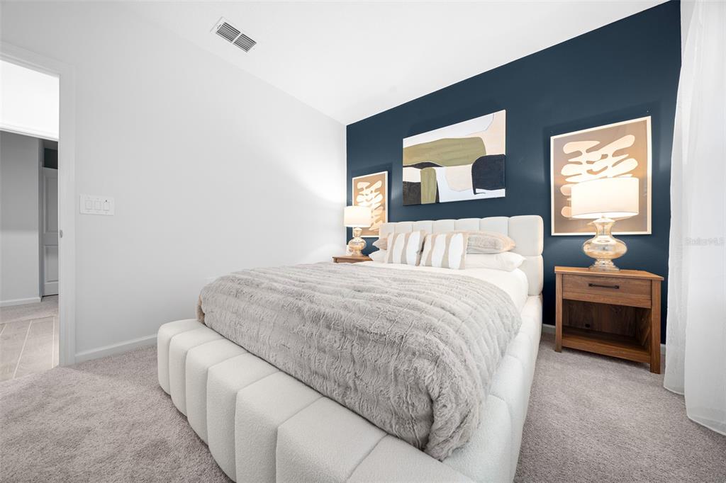 8735 Southwest 67th Circle Ocala, FL 34476 - Photo 4 of 35 a bedroom with a bed and a couch