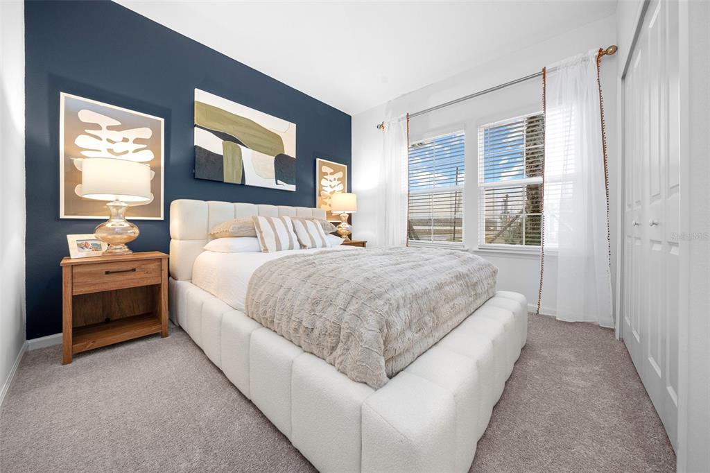 8735 Southwest 67th Circle Ocala, FL 34476 - Photo 6 of 35 a spacious bedroom with a bed and a window