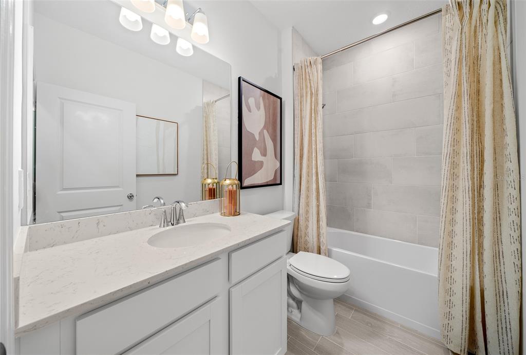 8735 Southwest 67th Circle Ocala, FL 34476 - Photo 8 of 35 a bathroom with a sink a toilet and shower