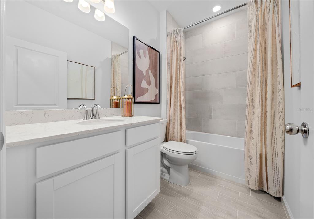 8735 Southwest 67th Circle Ocala, FL 34476 - Photo 9 of 35 a bathroom with a sink a toilet and shower