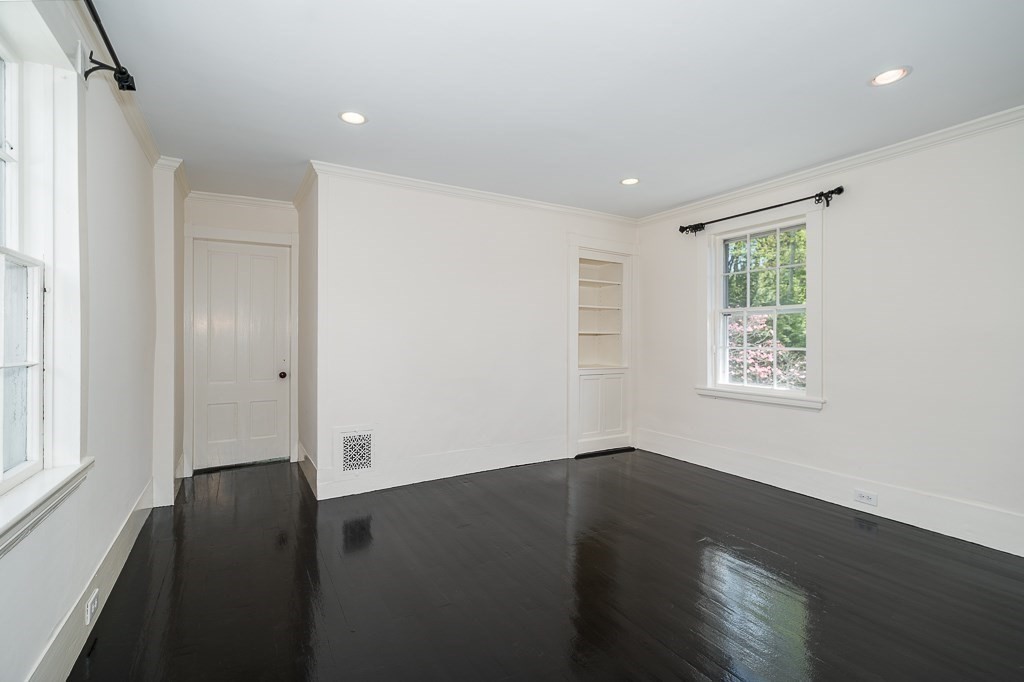 60 Walnut Road Wenham, MA 01984 - Photo 13 of 42 a view of an empty room with wooden floor and a window