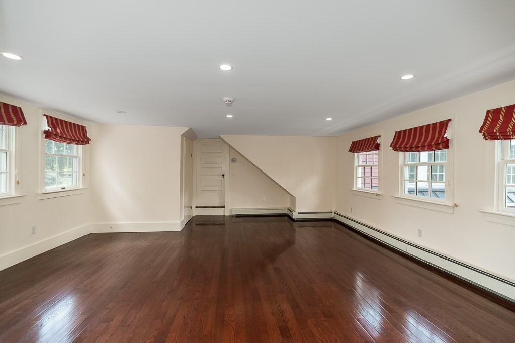60 Walnut Road Wenham, MA 01984 - Photo 14 of 42 a view of an empty room with wooden floor and a window