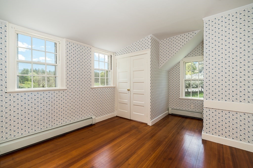 60 Walnut Road Wenham, MA 01984 - Photo 16 of 42 an empty room with wooden floor and windows