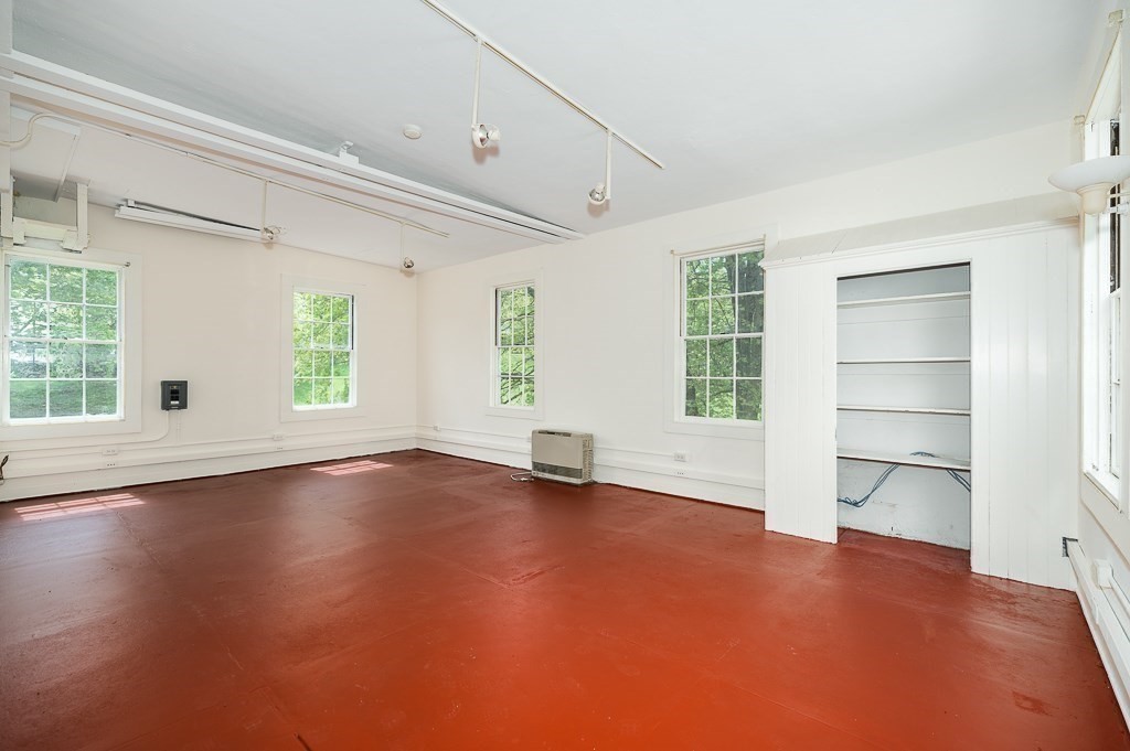 60 Walnut Road Wenham, MA 01984 - Photo 23 of 42 an empty room with wooden floor and windows