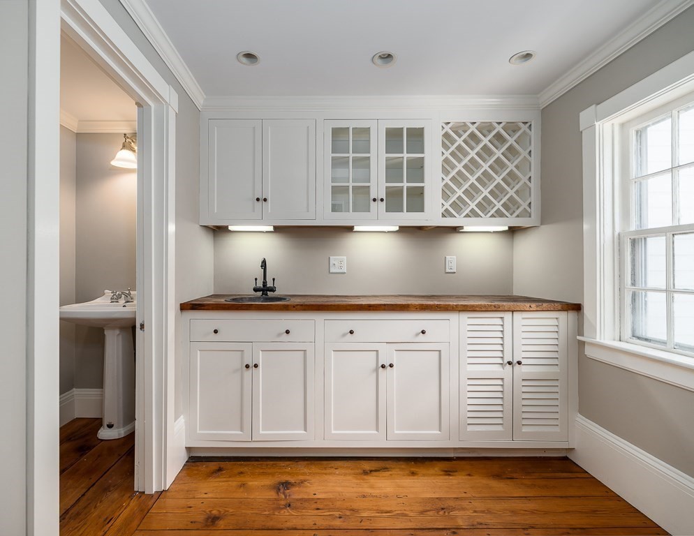 60 Walnut Road Wenham, MA 01984 - Photo 6 of 42 a kitchen with stainless steel appliances granite countertop a sink cabinets and wooden floor