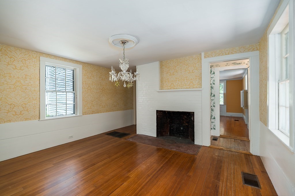 60 Walnut Road Wenham, MA 01984 - Photo 8 of 42 wooden floor fireplace and windows in an empty room
