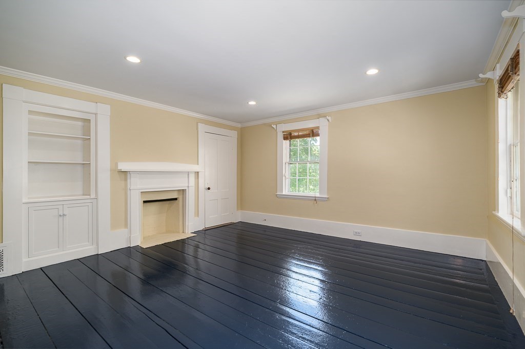 60 Walnut Road Wenham, MA 01984 - Photo 10 of 42 an empty room with wooden floor cabinet and windows