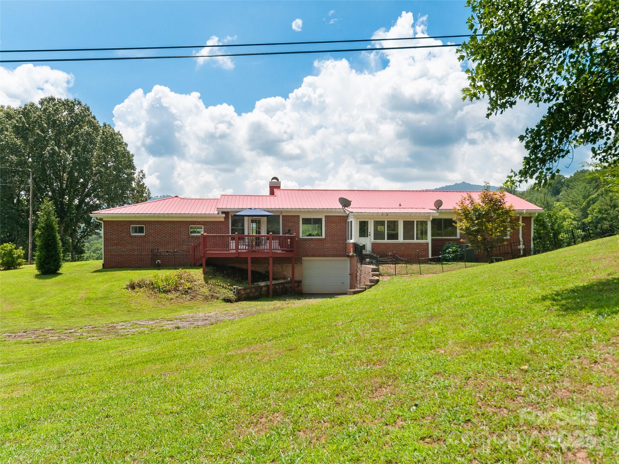 983 Lee Road Clyde, NC 28721 - Photo 37 of 41 a view of an house with backyard and garden