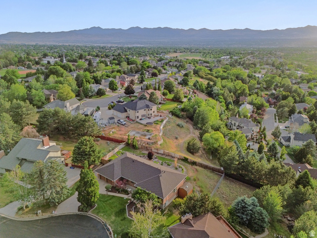 2342 Charros Road Sandy, UT 84092 - Photo 77 of 94 Expansive residential landscape showcasing varied architectural styles and mature tree coverage