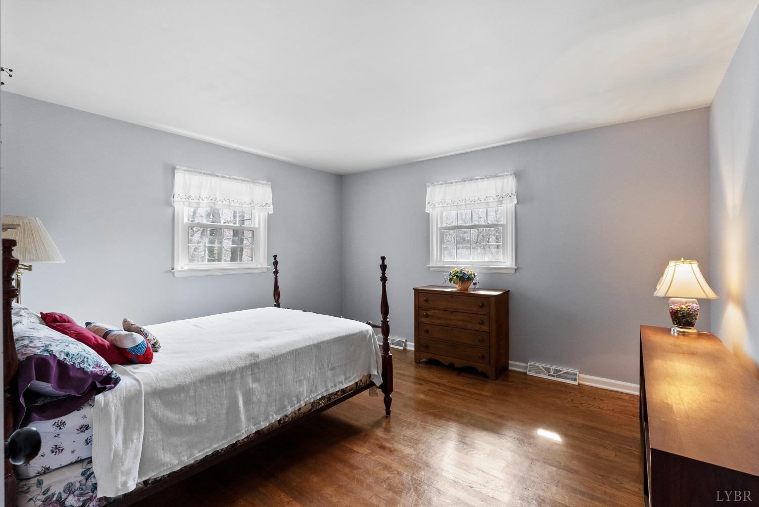 337 Peters Hollow Road Monroe, VA 24574 - Photo 24 of 53 a bedroom with a bed and a lamp on dresser