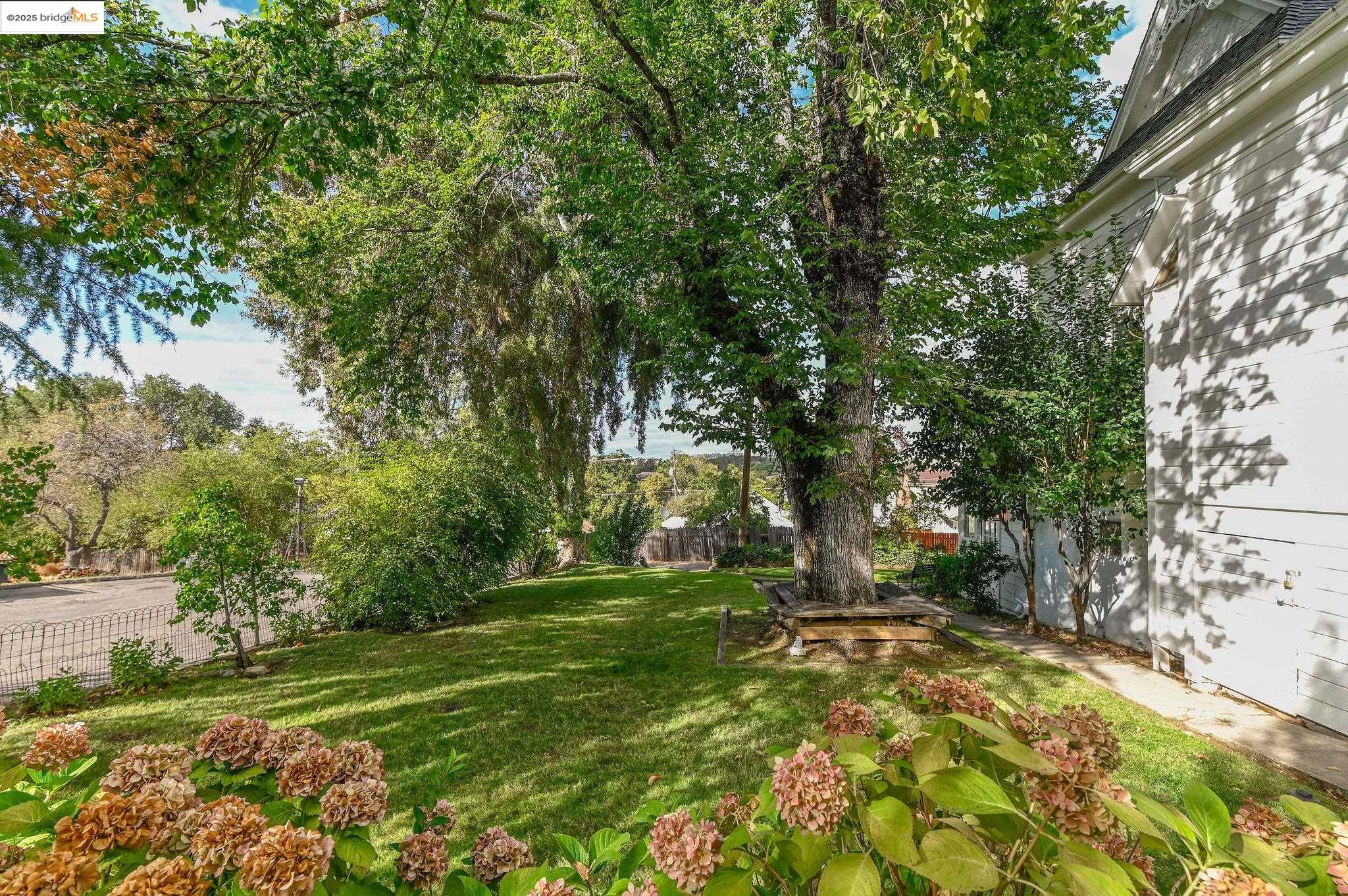 68 Church Hill Road San Andreas, CA 95249 - Photo 2 of 59 a backyard of a house with lots of green space and fountain