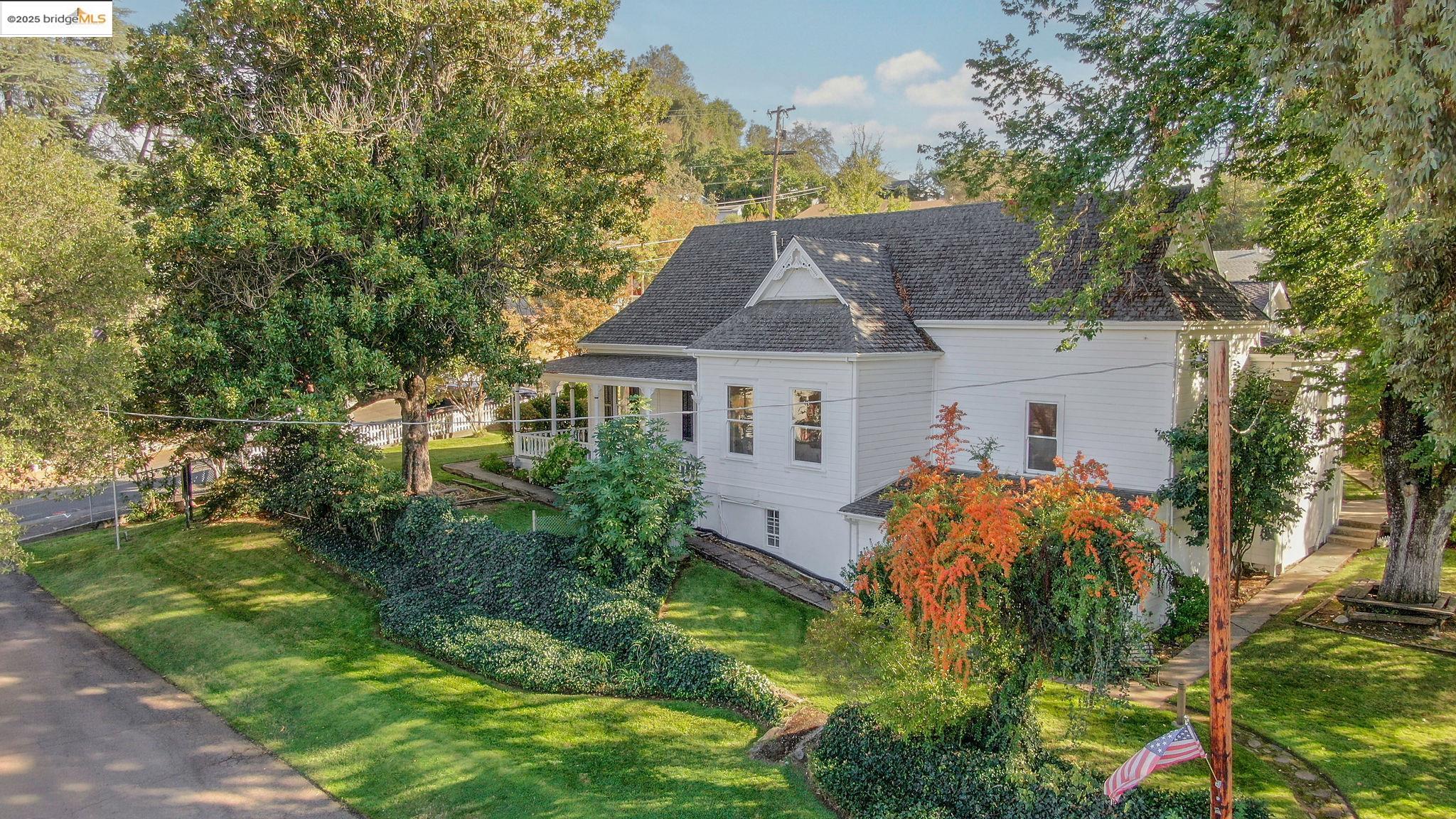 68 Church Hill Road San Andreas, CA 95249 - Photo 34 of 59 View of home's exterior featuring a lawn and roof with shingles