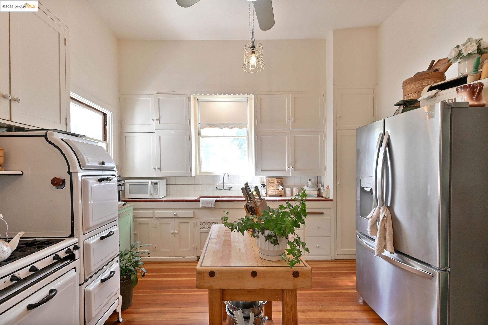 68 Church Hill Road San Andreas, CA 95249 - Photo 35 of 59 a kitchen with stainless steel appliances a refrigerator sink and wooden floor