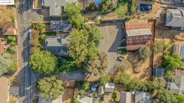 a view of a house with a yard and a garden