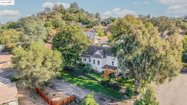 a bedroom with a bed and glass window