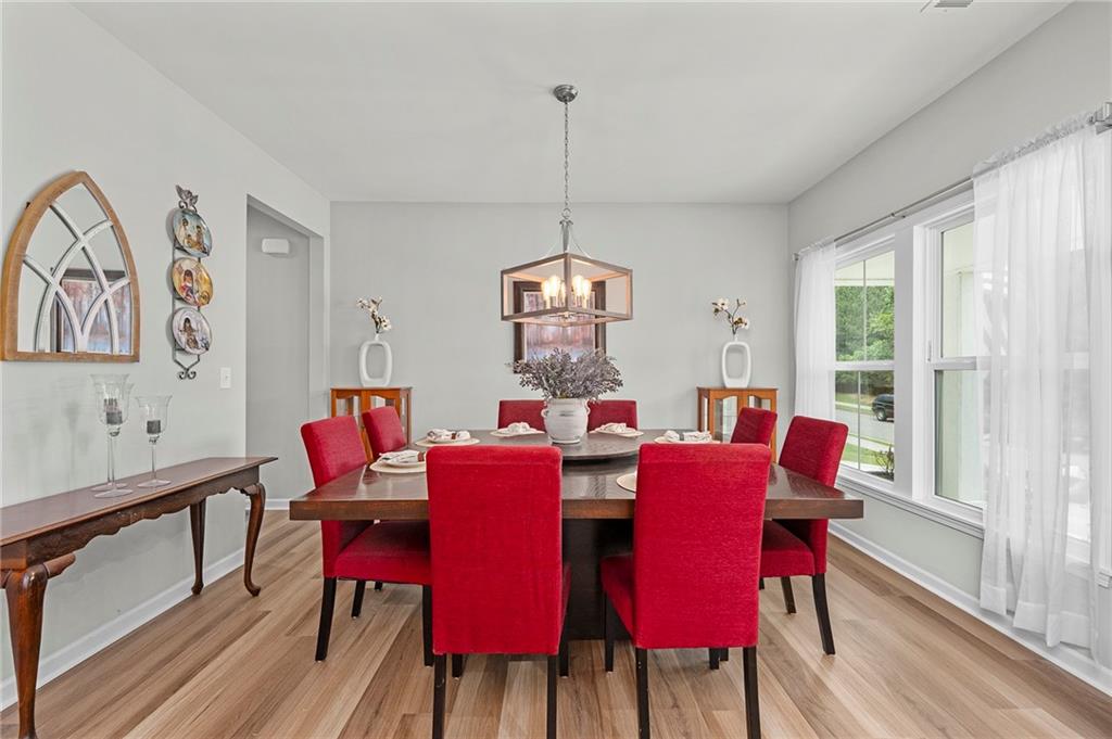 230 Augusta Walk Canton, GA 30114 - Photo 3 of 56 a view of a dining room with furniture window and wooden floor