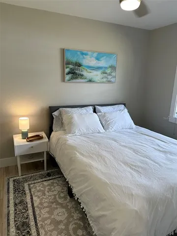 a bedroom with a bed and window