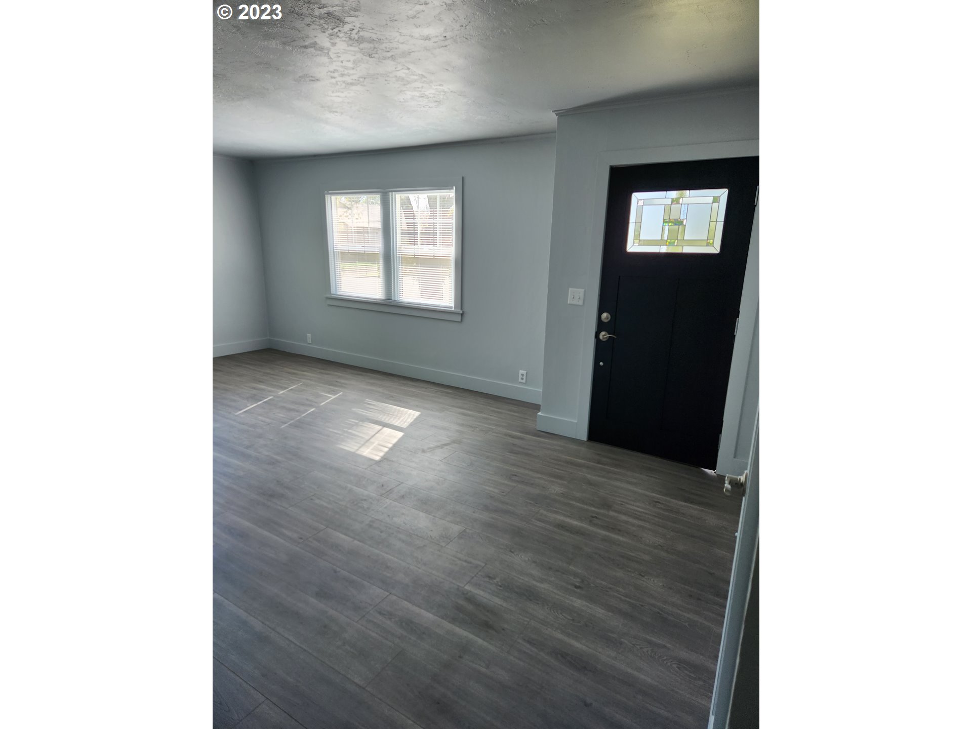 607 7th Street Springfield, OR 97477 - Photo 3 of 15 a view of a livingroom with a window