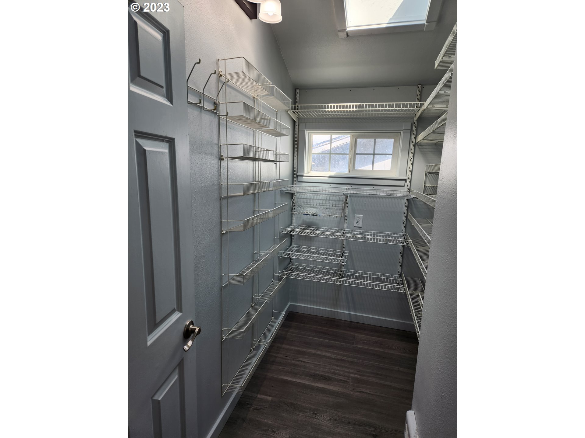 607 7th Street Springfield, OR 97477 - Photo 5 of 15 a view of walk in closet with wooden floor
