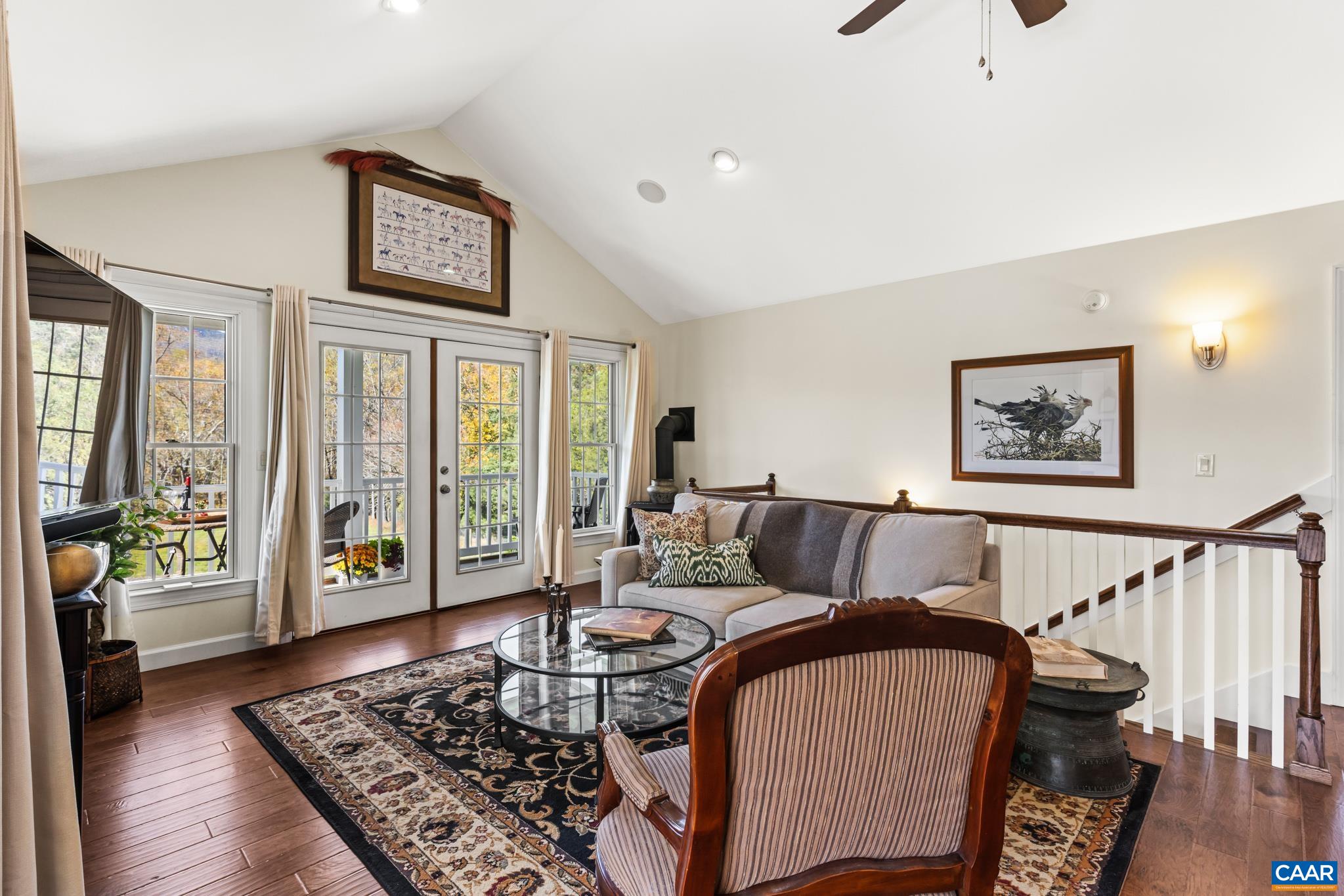 234 Creek Road Afton, VA 22920 - Photo 23 of 68 a living room with furniture and a wooden floor