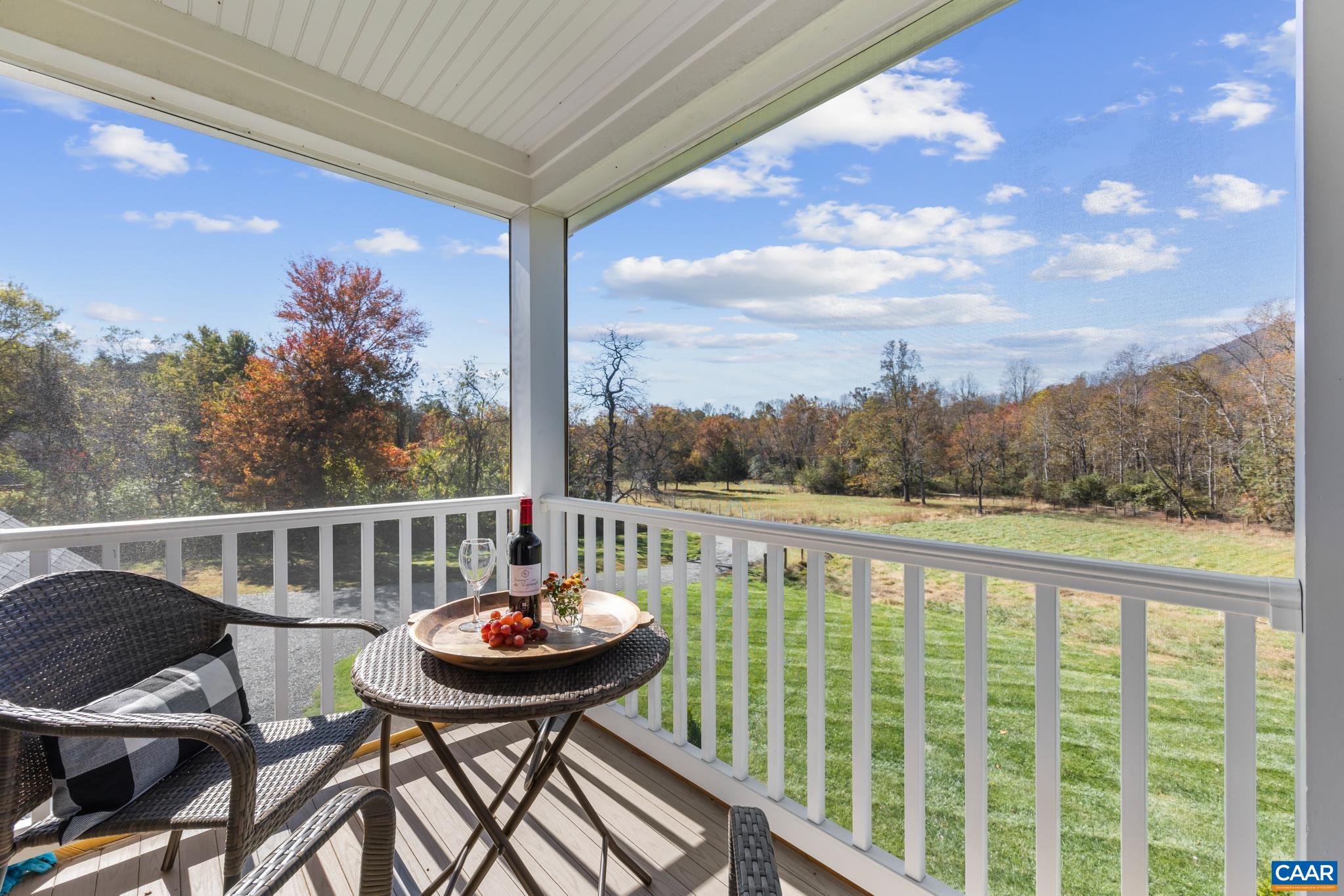 234 Creek Road Afton, VA 22920 - Photo 25 of 68 a view of a balcony with mountain view and a garden