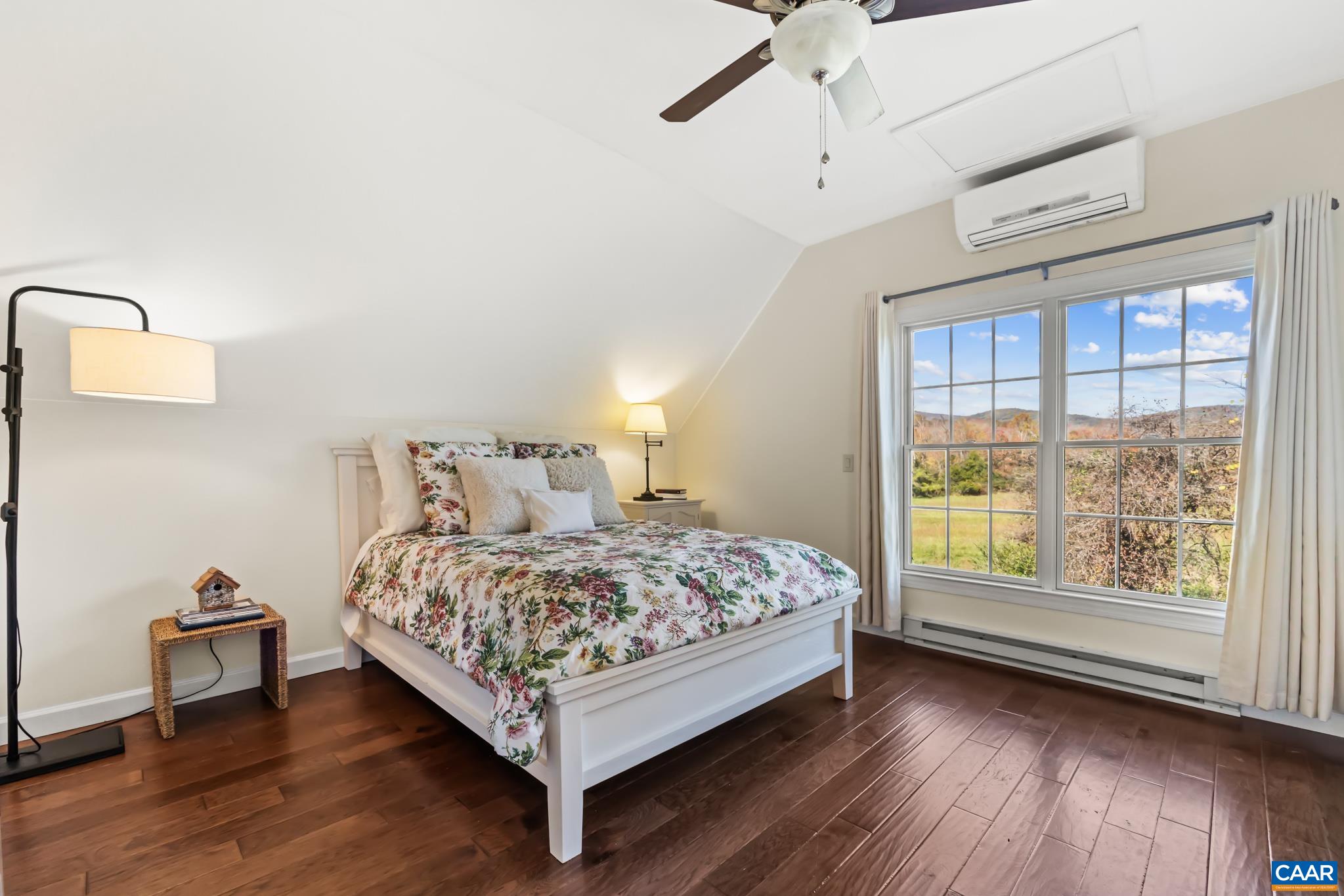 234 Creek Road Afton, VA 22920 - Photo 28 of 68 a bedroom with a bed lamp and window