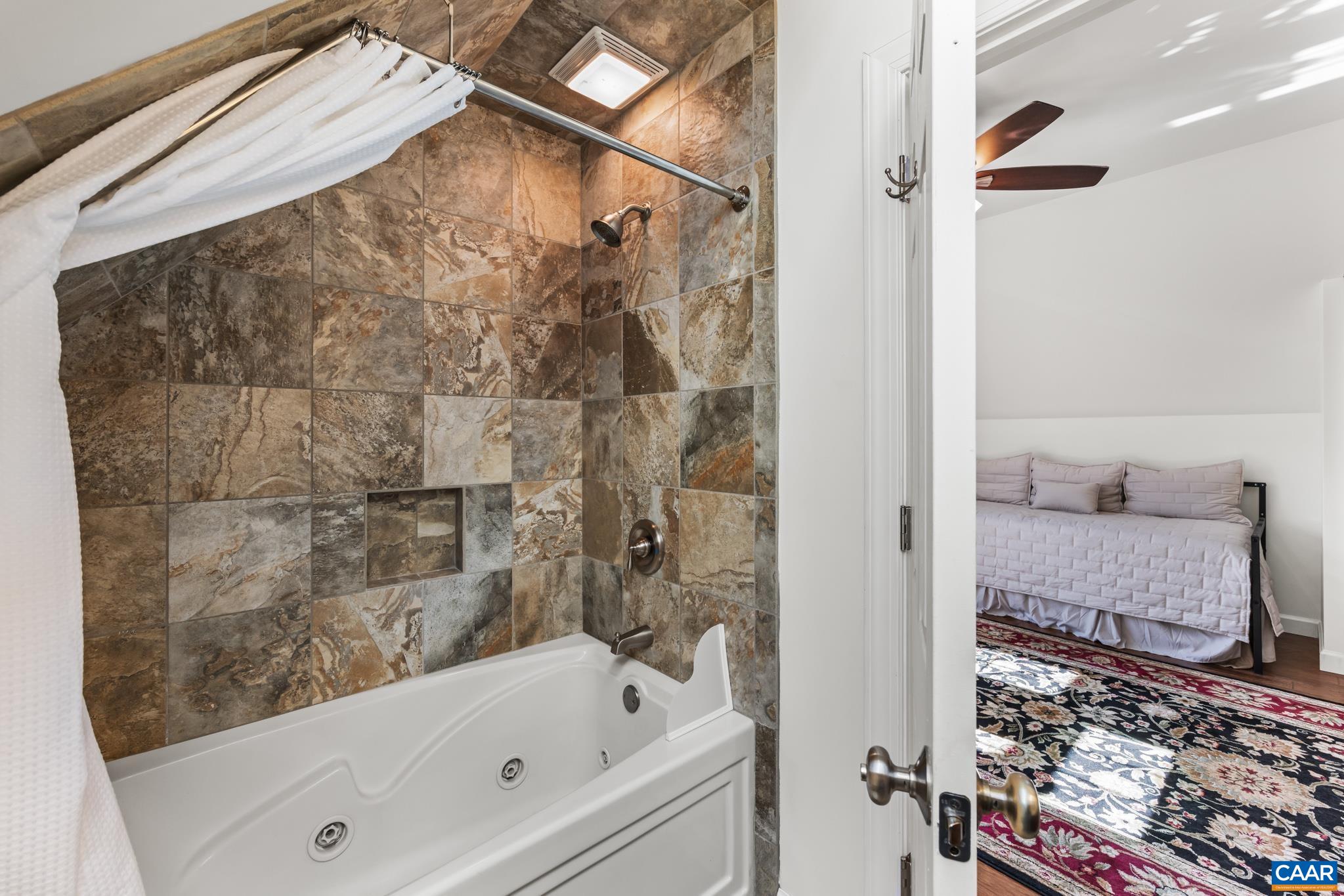 234 Creek Road Afton, VA 22920 - Photo 34 of 68 a bathroom with a bathtub and shower