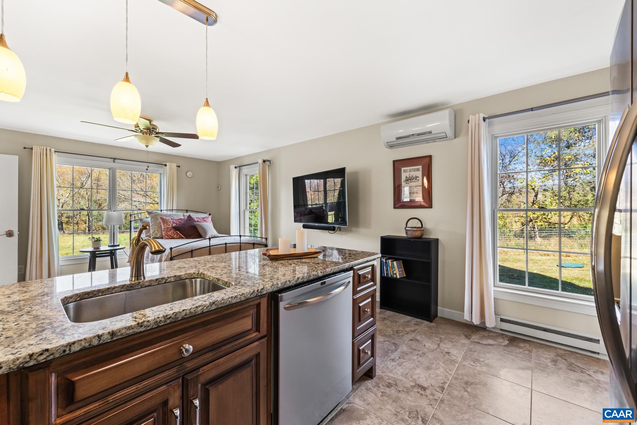234 Creek Road Afton, VA 22920 - Photo 37 of 68 a kitchen with granite countertop a sink and a stove