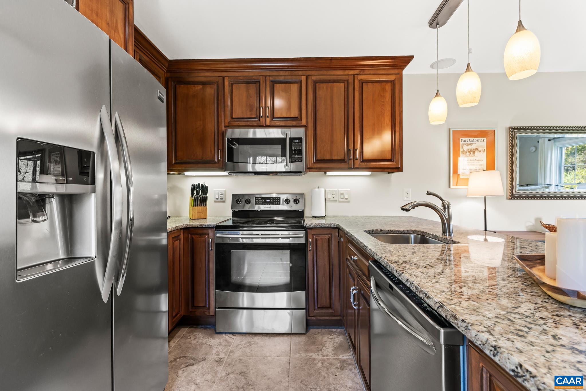 234 Creek Road Afton, VA 22920 - Photo 38 of 68 a kitchen with stainless steel appliances granite countertop a sink stove refrigerator and cabinets