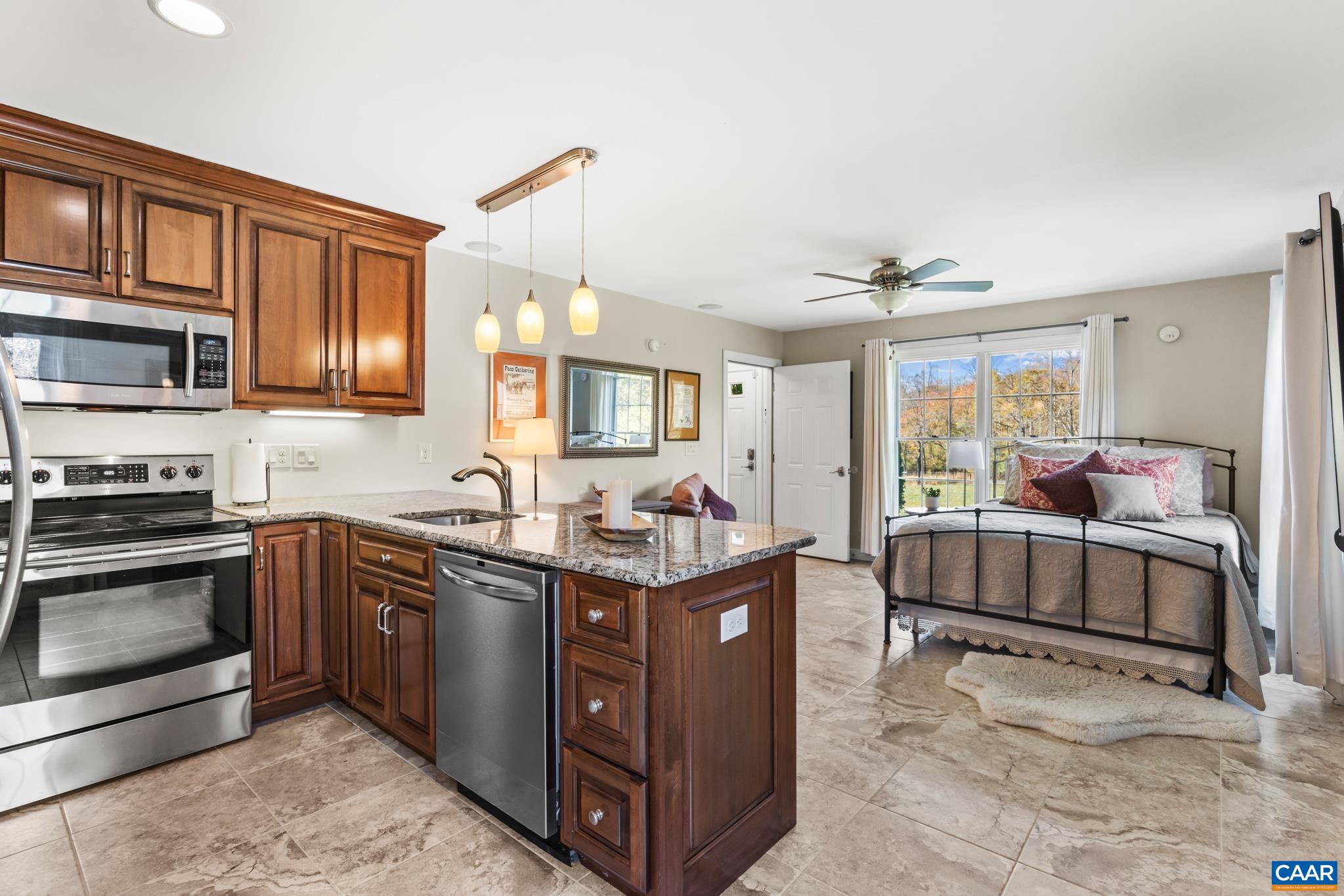 234 Creek Road Afton, VA 22920 - Photo 39 of 68 a kitchen with stainless steel appliances granite countertop a stove and a sink